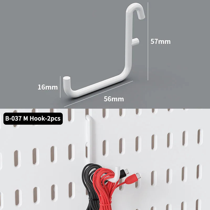 A white M hook is shown next to a measuring scale, with several colored cables visible on a pegboard organizer.