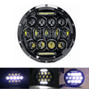 Round LED headlight assembly with multiple projector lenses and angel eyes for a motorcycle.