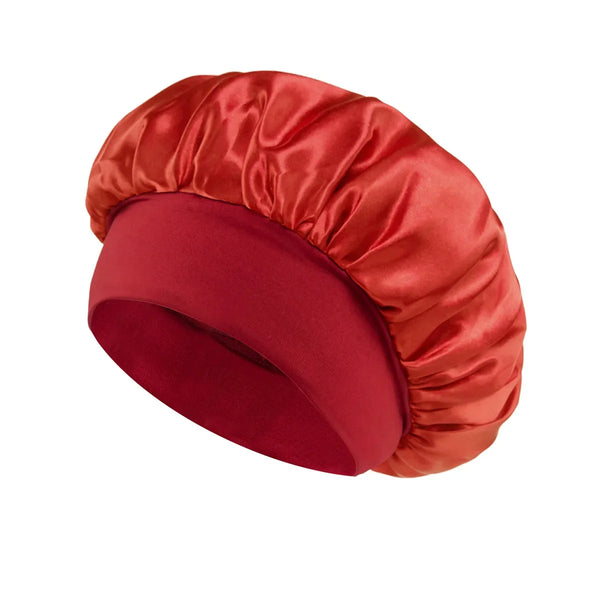 A deep red satin sleep bonnet with a wide brim, shown from above.