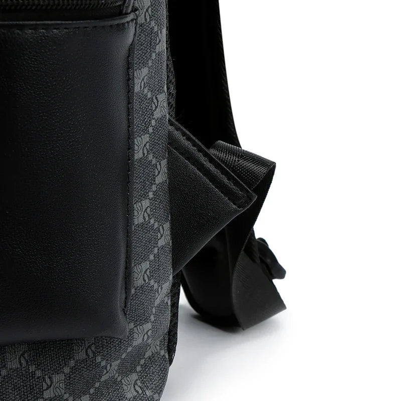 Close-up of a black PU leather backpack strap and detail with a subtle gray pattern.