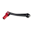 A black and red CNC aluminum folding gear shift lever for motorcycles and dirt bikes.