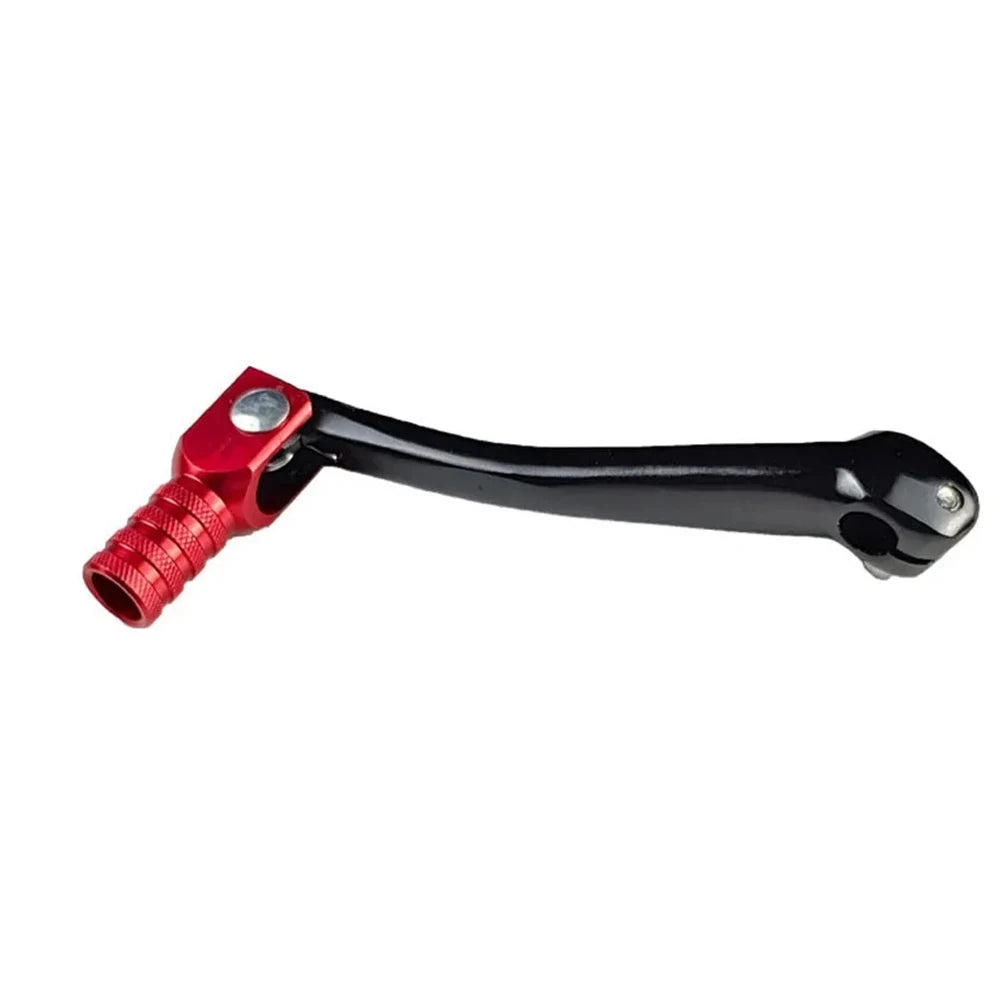 A black and red CNC aluminum folding gear shift lever for motorcycles and dirt bikes.