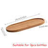 A wooden refillable soap dispenser bottle suitable for 3 pieces.