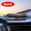 A close-up of a Black-B car emergency hammer with a seat belt cutter and window breaker resting on a car interior surface.