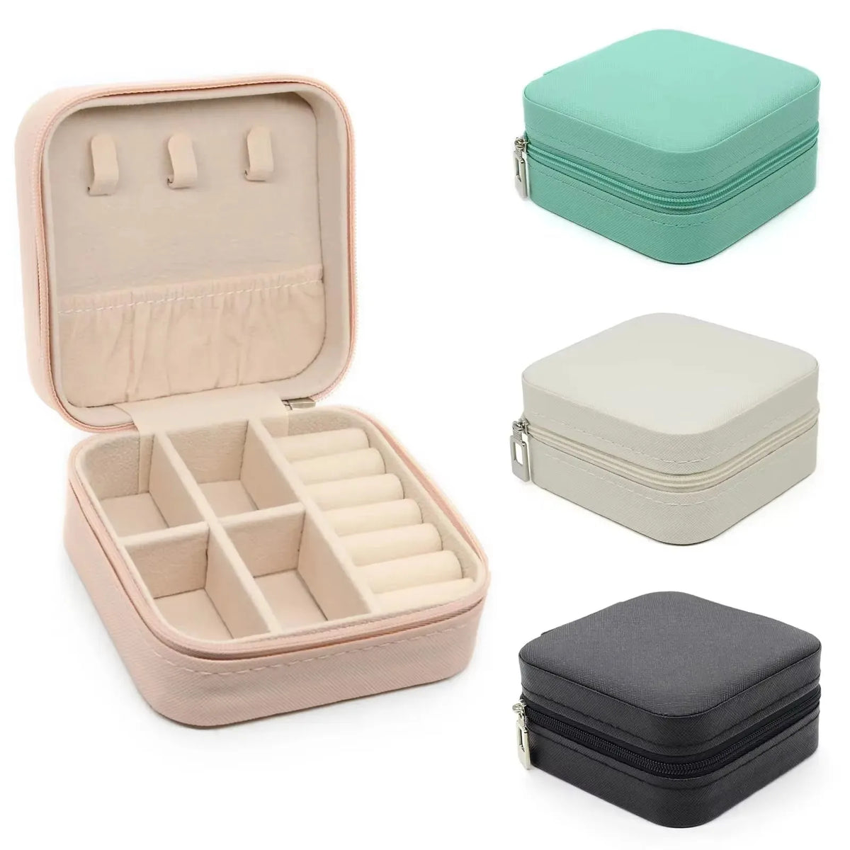 A set of PU leather jewelry storage boxes in pink, beige, and gray, some zipped for travel.