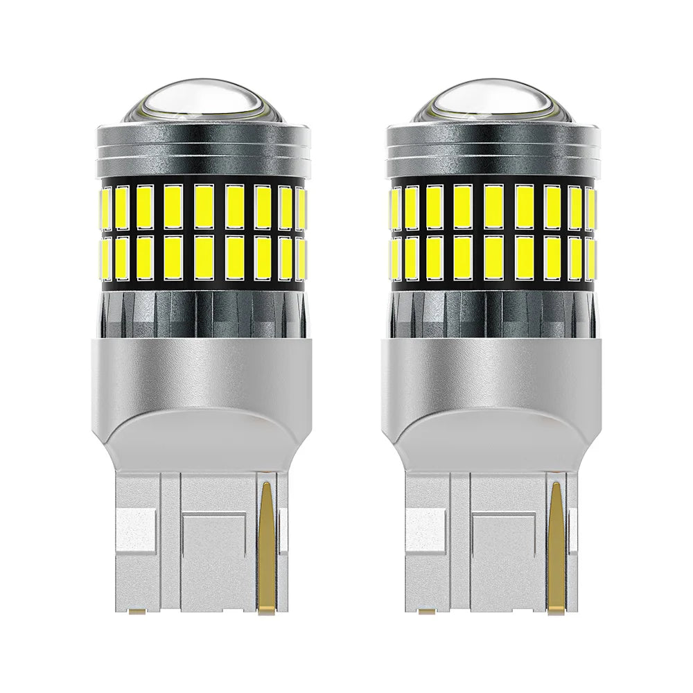 A pair of LED turn signal and reverse light bulbs with clear glass lenses and silver bases.