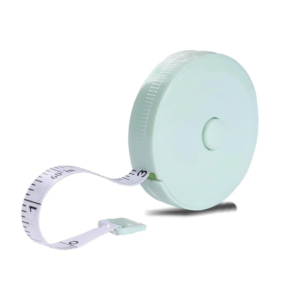 A light mint green flexible soft tape measure with dual-sided markings and a white strap.