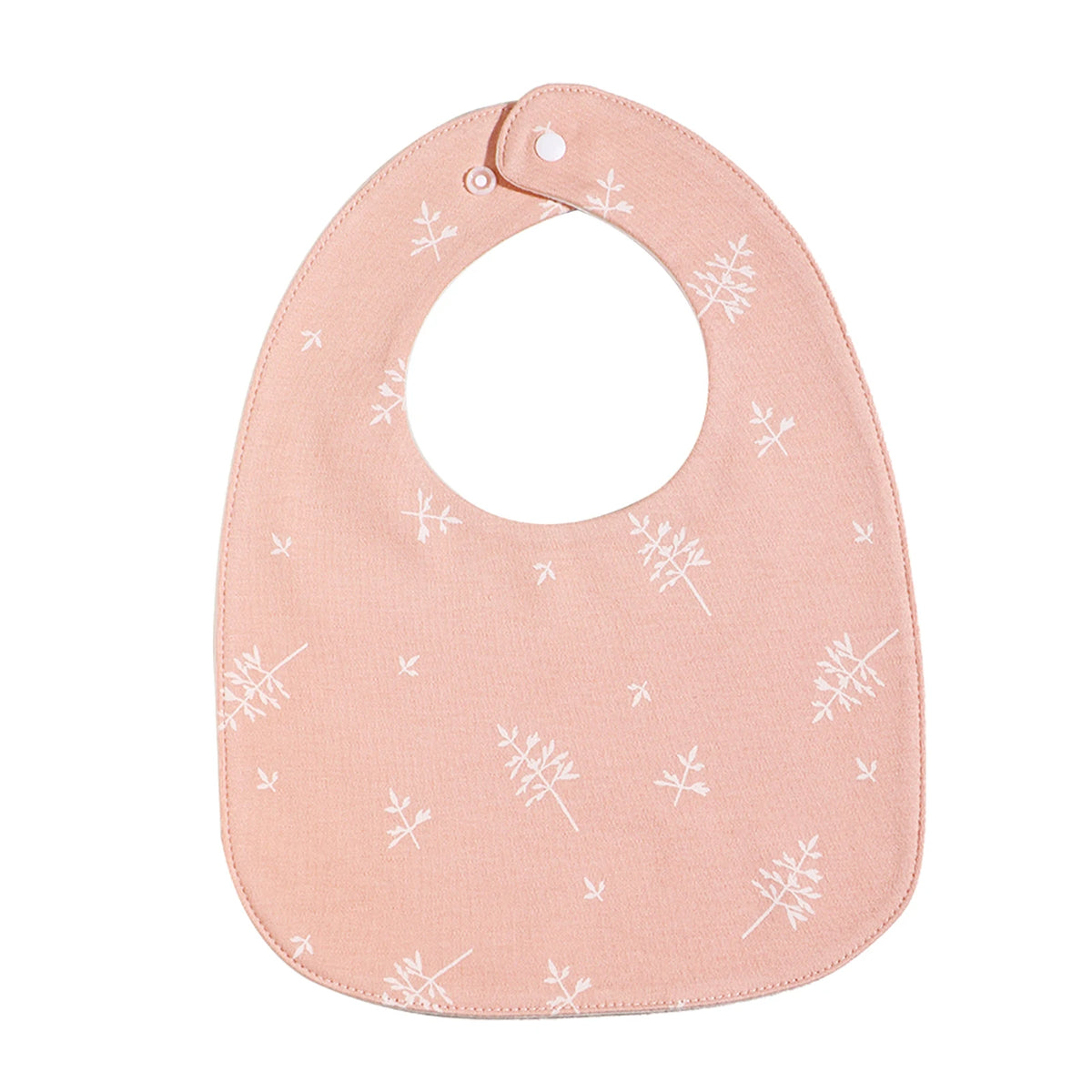 A light pink baby bib with a U-shaped design featuring a white snowflake pattern.