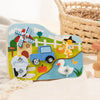 A wooden farm animal assembly toy featuring various animals, a tractor, and tools on a colorful background.