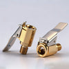 A set of solid brass lock-on air chucks for tires, shown in a close-up view.