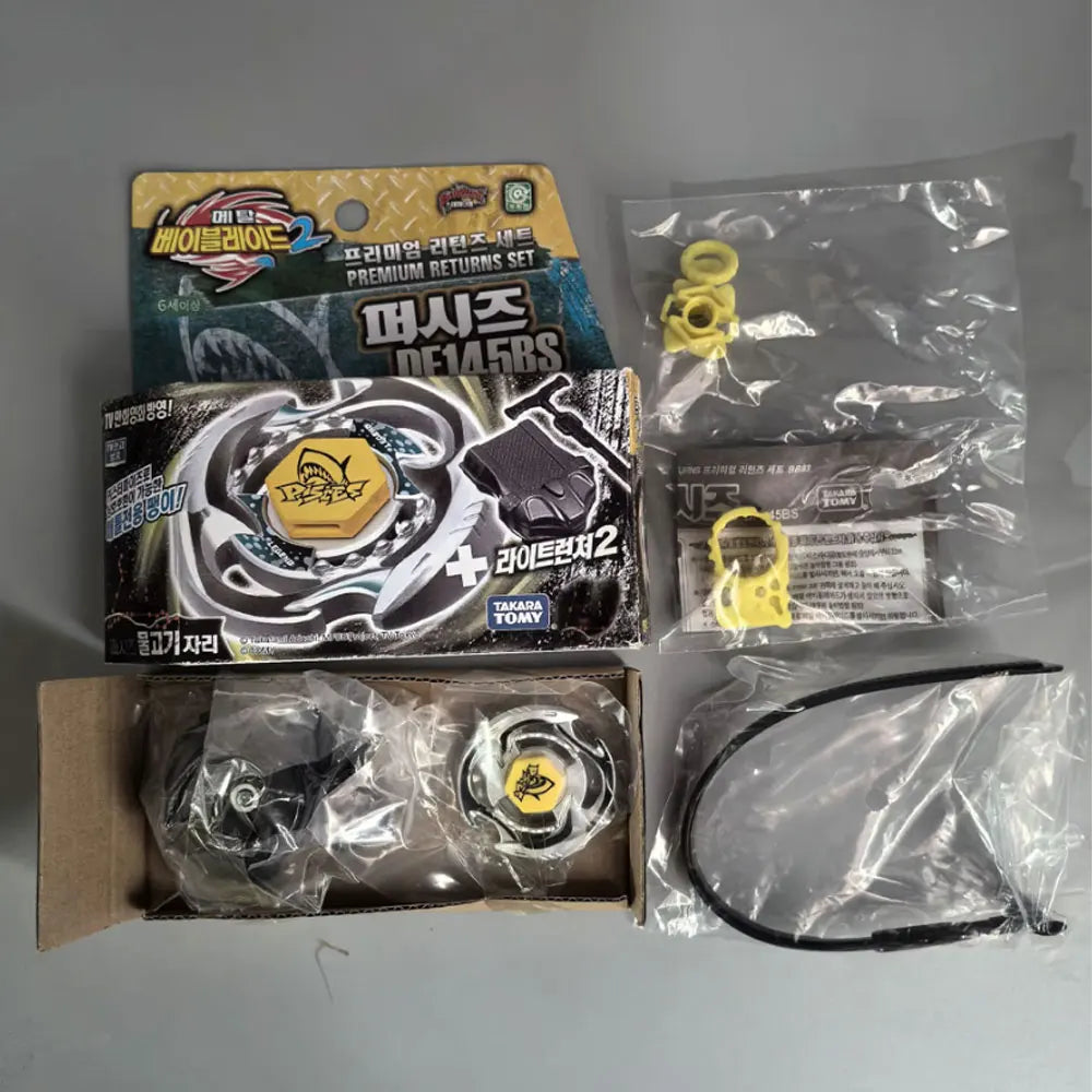 A set of premium metal spinning tops and related accessories packaged in cardboard and plastic bags.