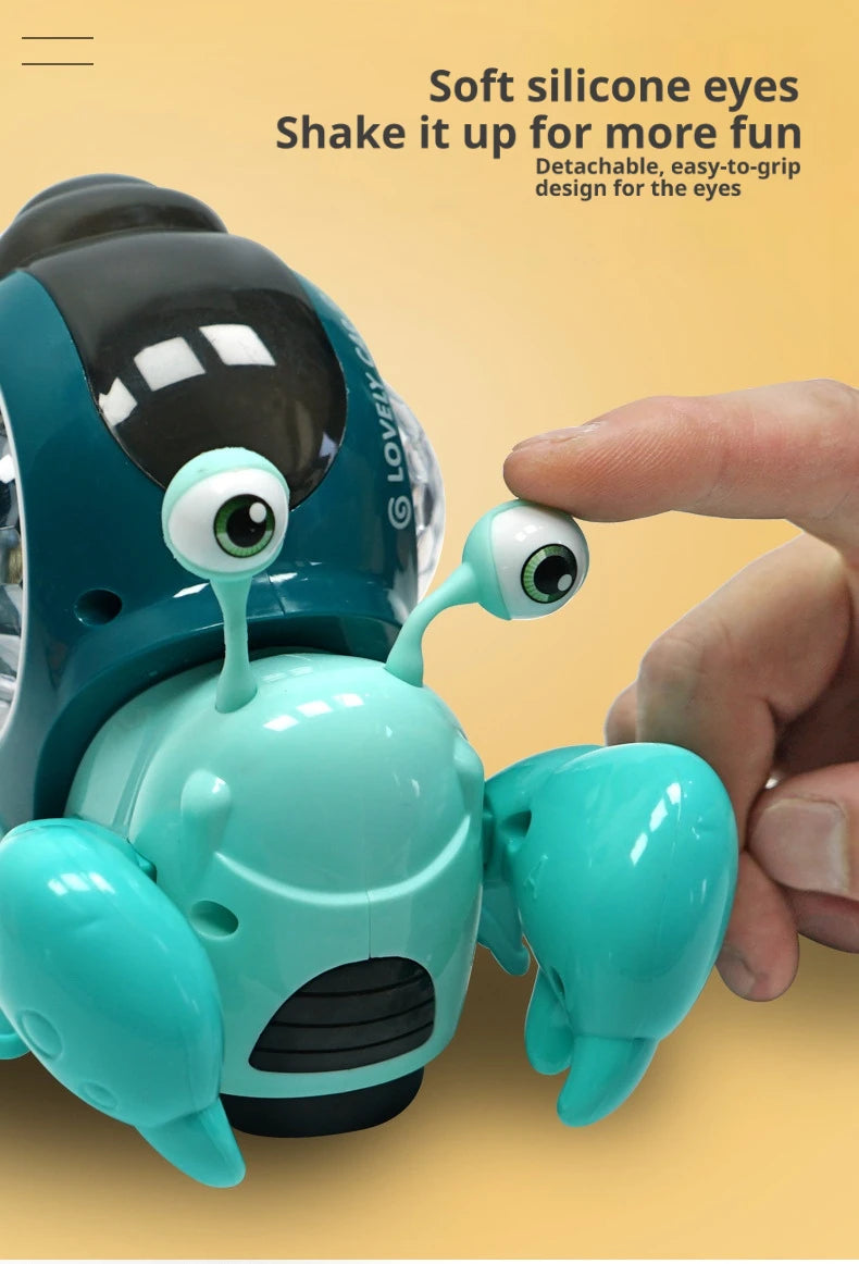 A hand is shaking a soft silicone eye on a teal crawling crab toy for fun.