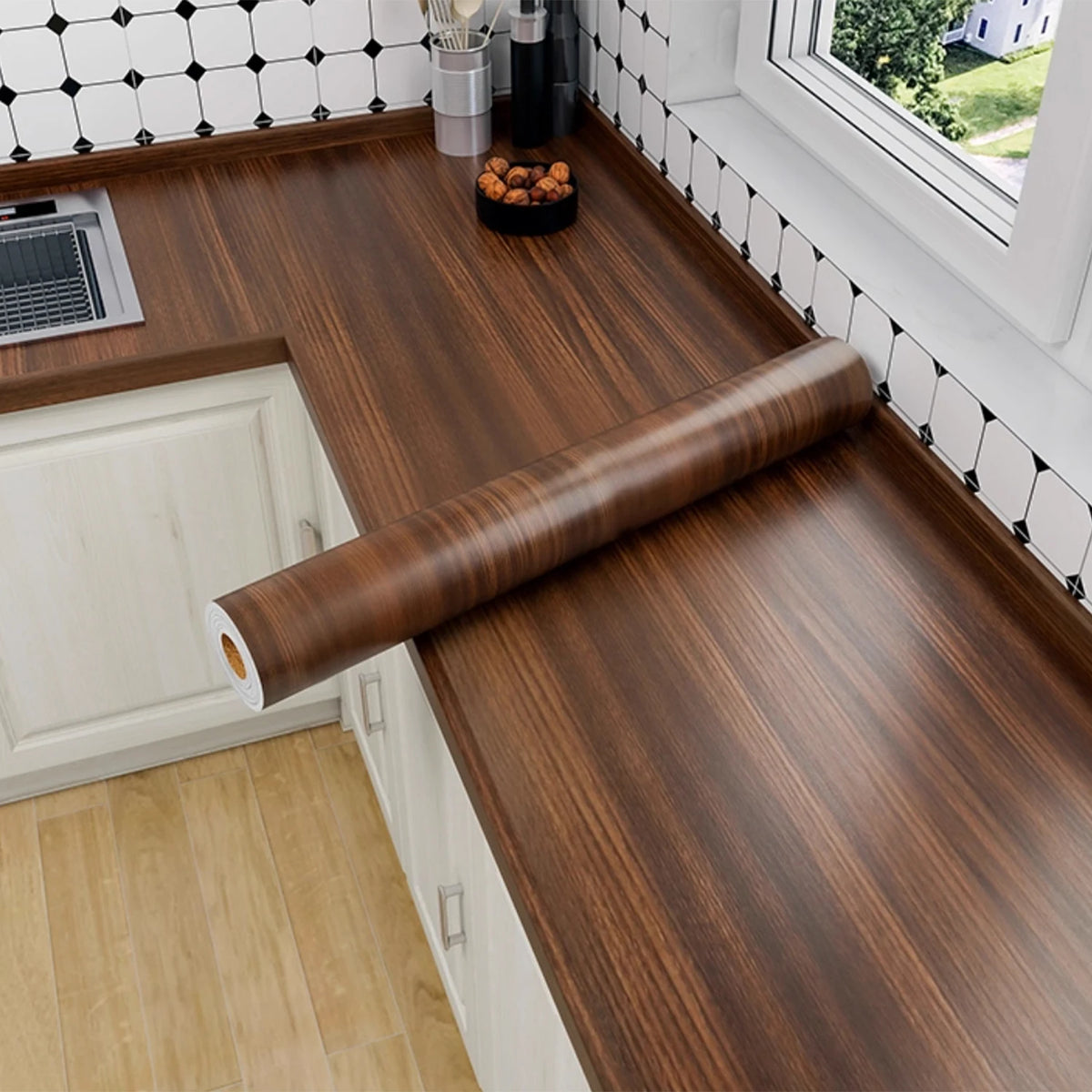 A roll of self-adhesive wood grain wallpaper in a rich brown tone displayed on a kitchen countertop.