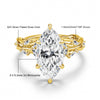 A gold-plated rose gold engagement ring featuring a marquise cut moissanite stone and accent diamonds.