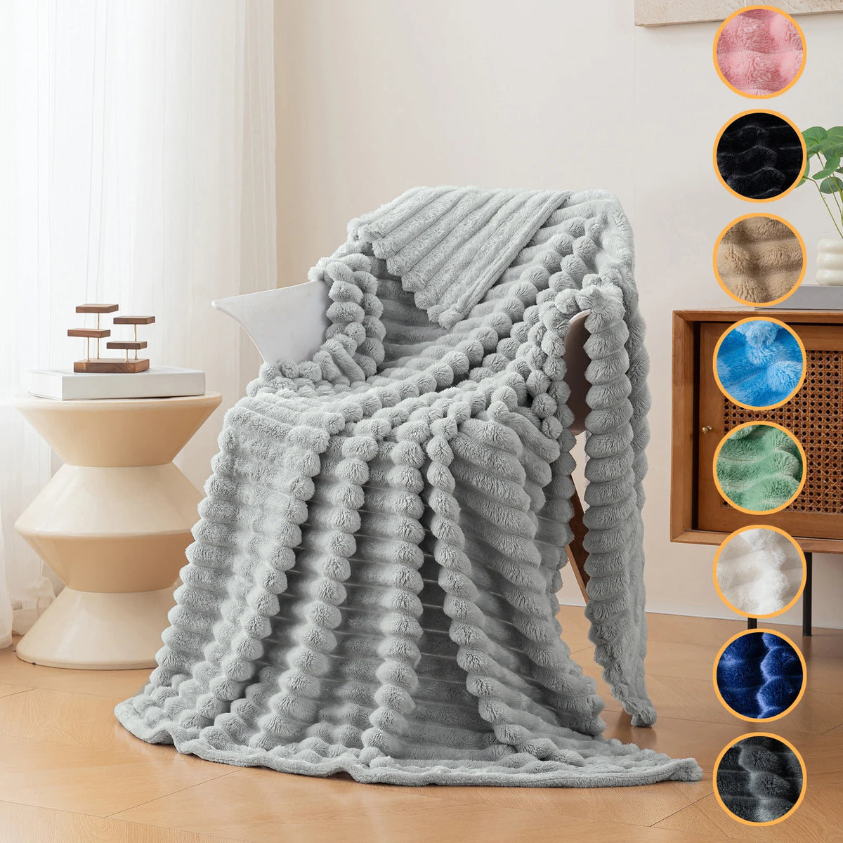 A light gray soft and cozy brushed flannel throw blanket draped on a wooden surface.