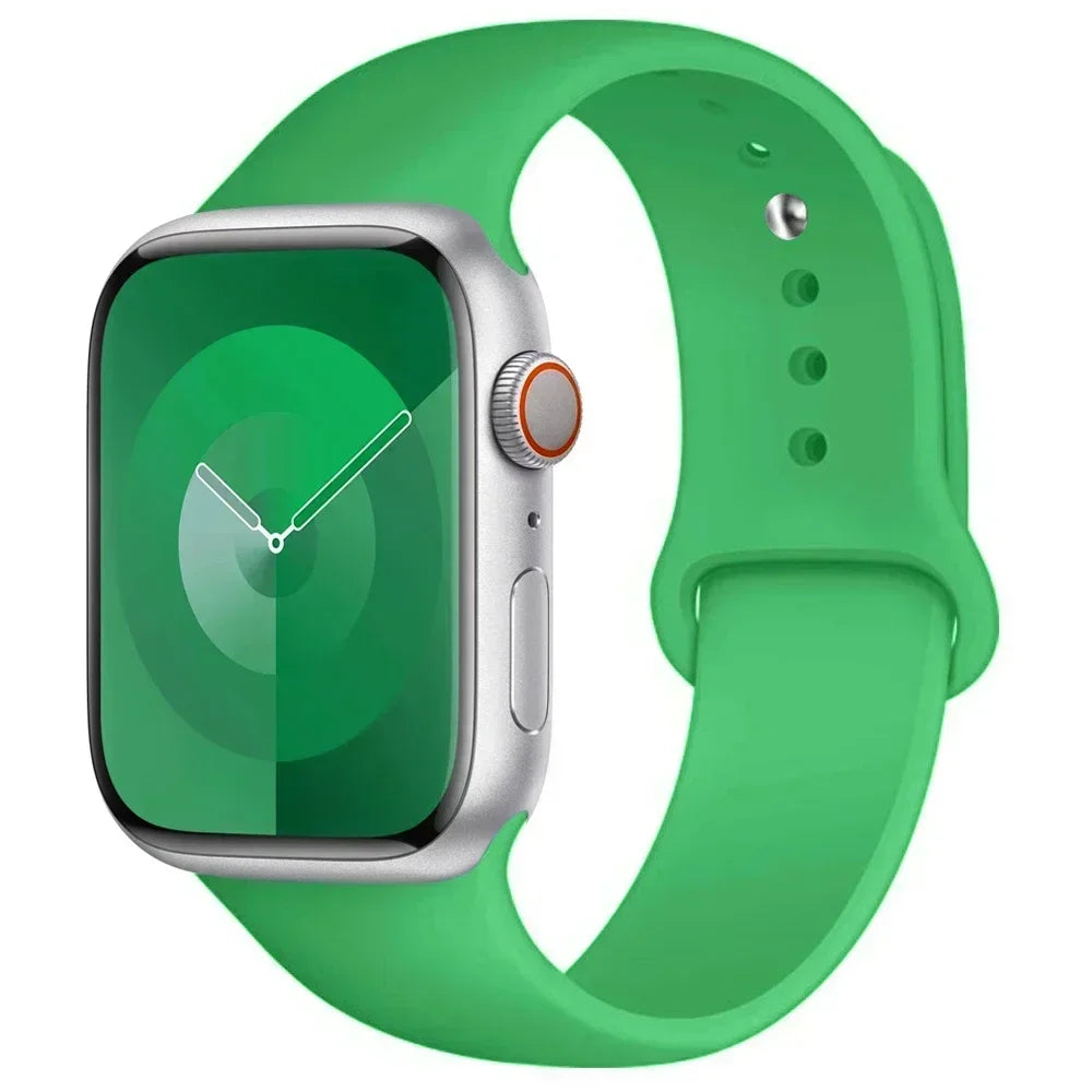 A green silicone sport band for an Apple Watch displayed on a white background.