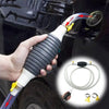 A hand is using a portable siphon pump kit with a white hose and yellow flow control valve to clean a car's exterior.