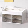 White desk organizer with four transparent drawers and yellow measuring lines.