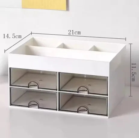 White desk organizer with four transparent drawers and yellow measuring lines.