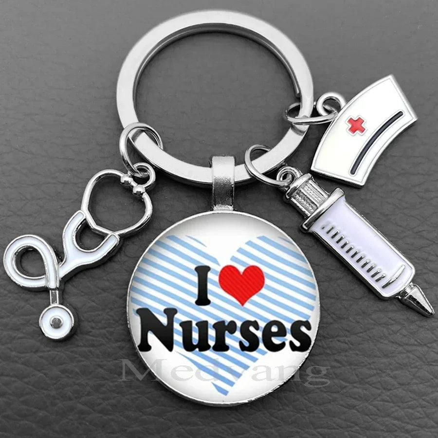 Silver keychain featuring a glass dome charm with the text I Love Nurses and a medical symbol.