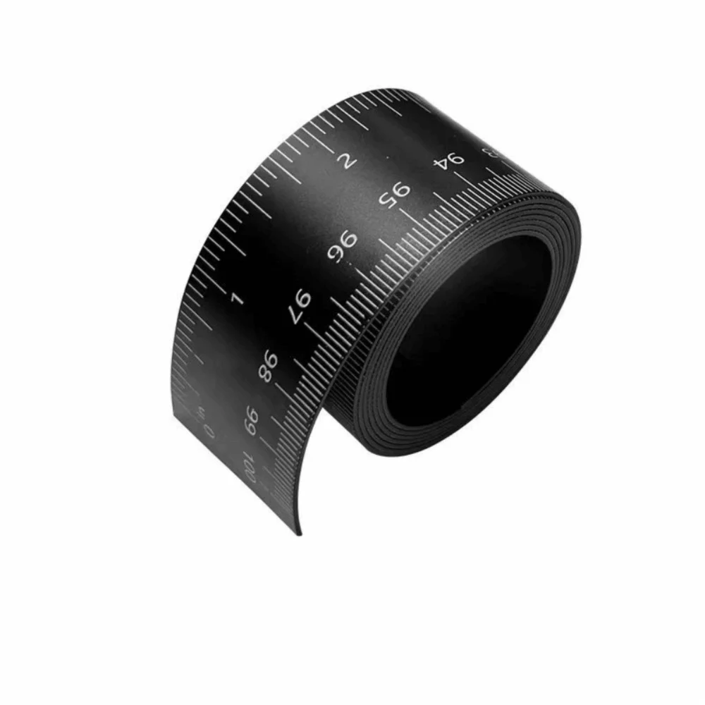 A black magnetic flexible measuring ruler with a dual scale marked in centimeters and inches.