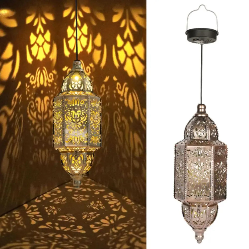 A hanging solar-powered Moroccan lantern with waterproof ironwork design casting intricate shadows.