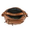 A brown leather tote bag with a dark lining and adjustable strap, shown open.