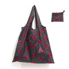 Black and red floral polka dot reusable shopping tote bag with a matching carry pouch