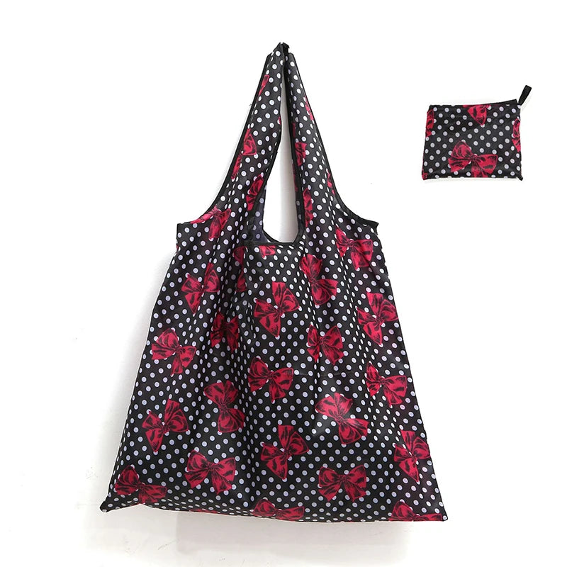 Black and red floral polka dot reusable shopping tote bag with a matching carry pouch