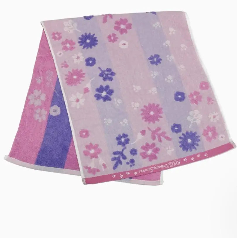A folded pink and purple striped cotton face towel with a floral embroidery pattern.