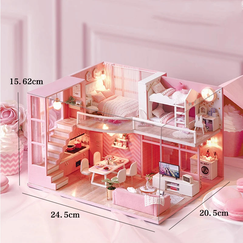 A pink wooden dollhouse miniature building kit featuring furniture and interior details.