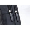 Close-up of a black men's adjustable crossbody chest bag featuring silver zippers and fashion branding.