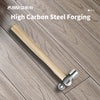 Walnut wood handle ball peen hammer with a high-carbon steel head resting on a wooden surface.