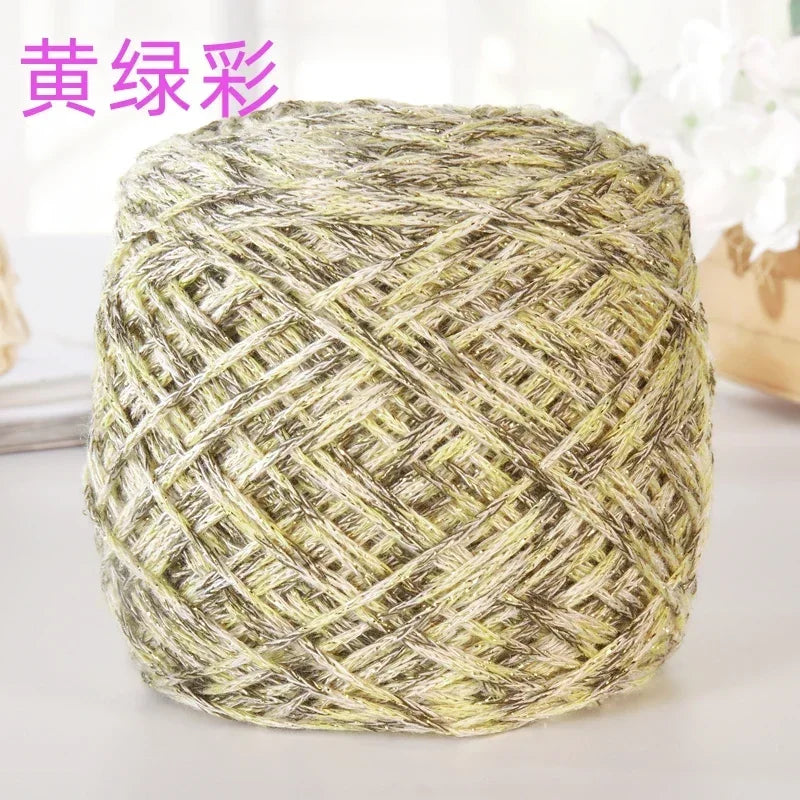 A ball of metallic silver shimmer crochet yarn used for knitting and macrame projects.