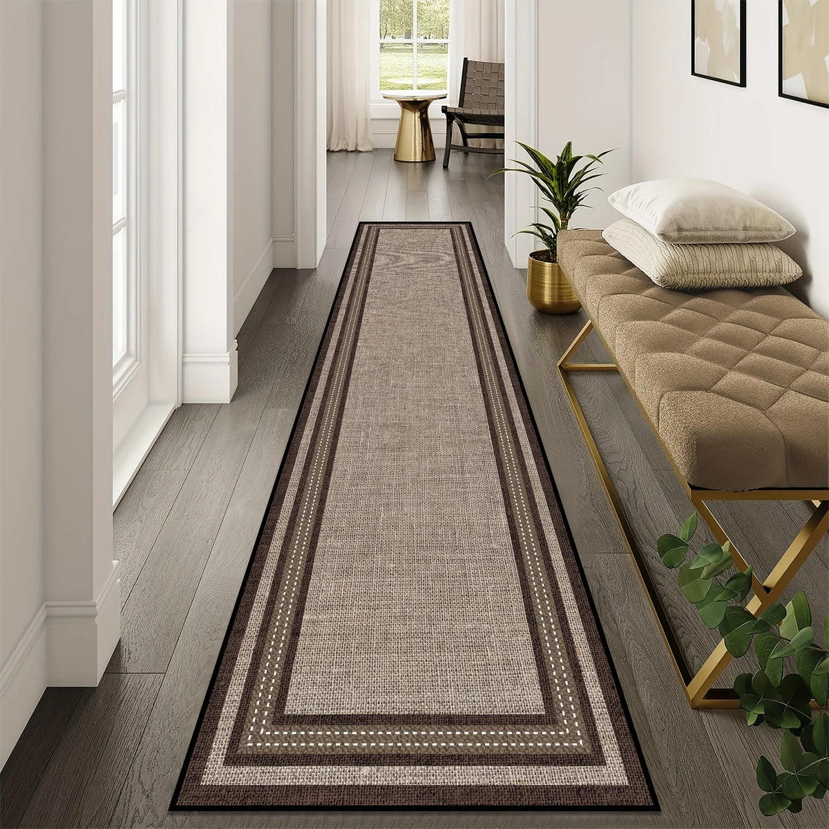 A long runner rug with geometric patterns in shades of brown, grey, and beige placed on a wooden floor.