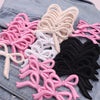 Assortment of pink, white, and black embroidered cartoon bow iron-on patches for DIY clothing decoration
