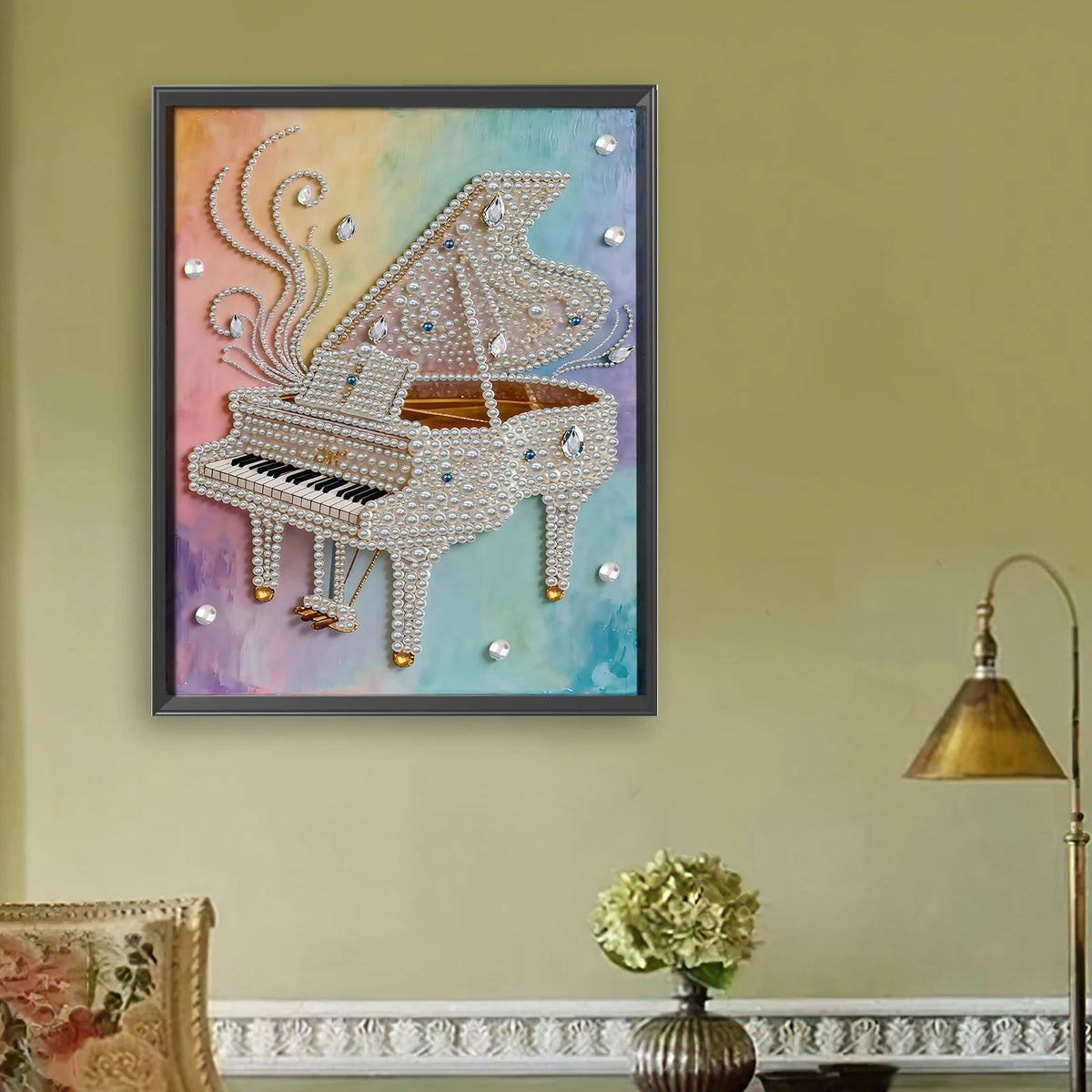 A framed painting featuring a silver-colored accordion or musical instrument decorated with white pearls and shimmering accen