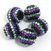 A set of five resin rhinestone beads with a two-tone striped design in purple and green.