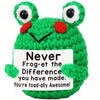 A bright green crocheted plush ornament shaped like a frog with large eyes and a smiling mouth.