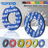 A collection of motorcycle handlebar grips donuts in various colors including black, red, yellow, green, orange, and blue.