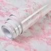 Roll of waterproof self-adhesive marble wallpaper in white and pink marbled pattern