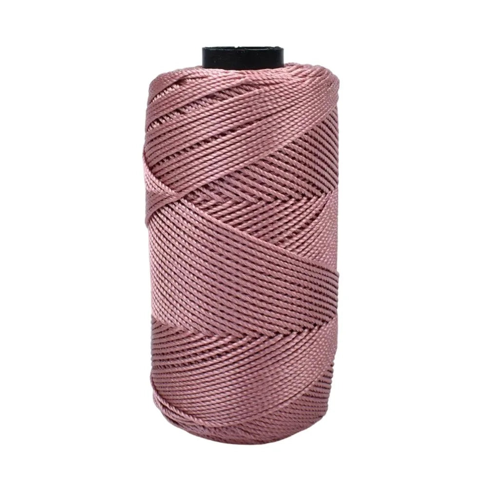 A skein of pink ice cotton silk thread used for knitting and crochet.