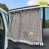 Black and white checkered sun shade curtains for a car window featuring a small bear charm
