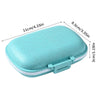 Light blue weekly pill organizer with an open lid and compartment measurements displayed.