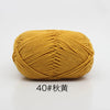 A ball of golden yellow 4-ply milk cotton yarn for knitting and crochet.