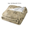 A beige plush throw blanket featuring a faded Middle Earth map design.