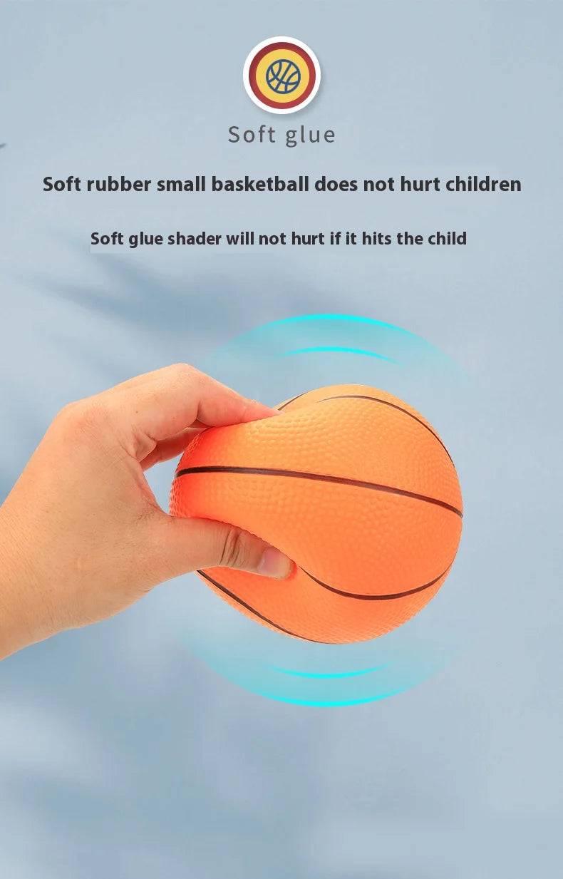 A hand is holding an orange rubber basketball, demonstrating the safety of soft glue against children.