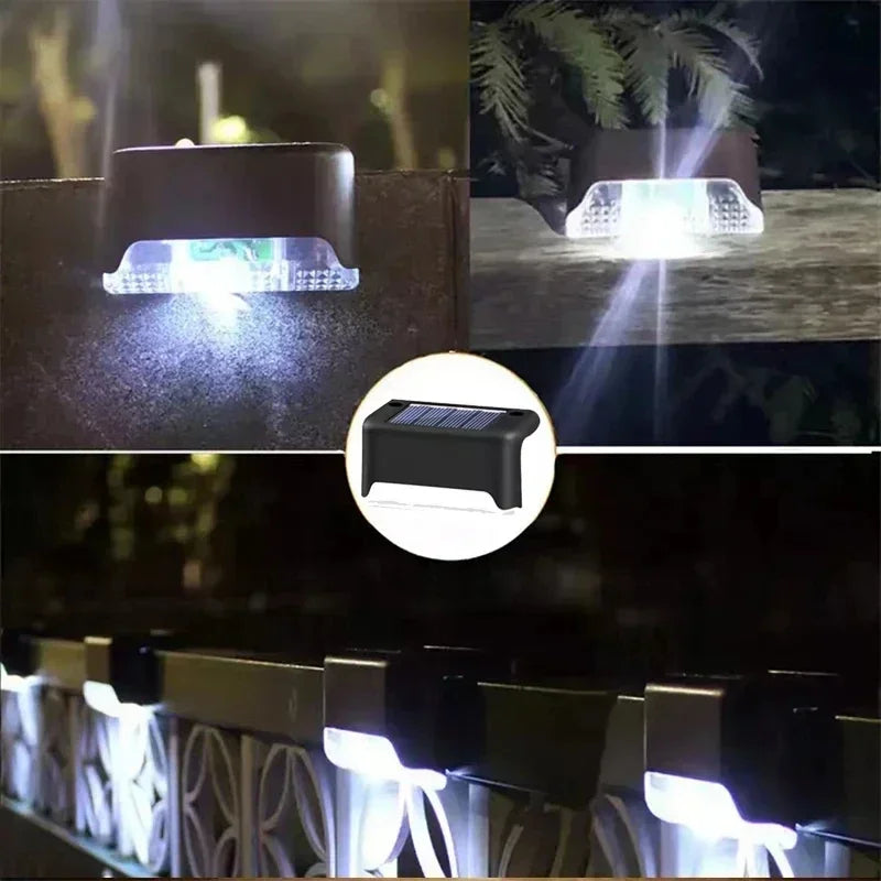 Close-up view of solar powered LED step lights illuminating an outdoor pathway or deck.