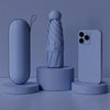 A light blue compact folding umbrella is displayed next to a smartphone and a cylindrical accessory on a surface.