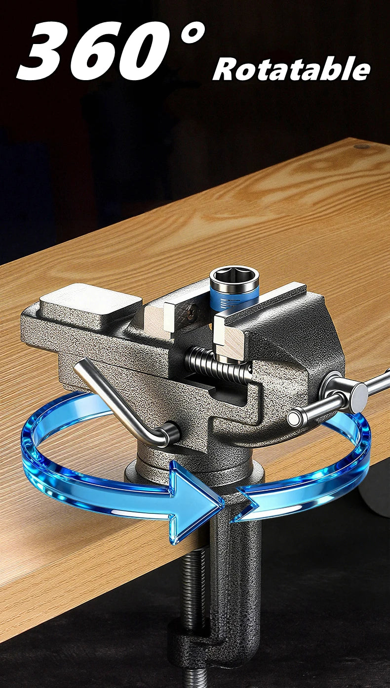 A close-up of a metal clamp-on vise with a blue rotating mechanism mounted on a wooden workbench.